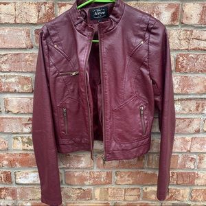 A maroon leather jacket